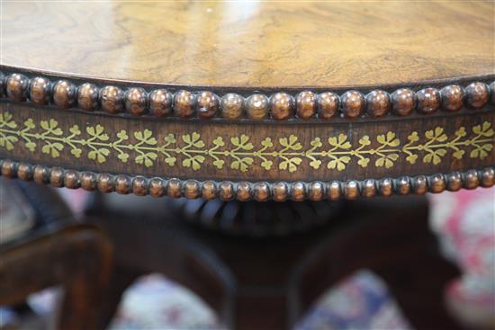 An early 19th century rosewood and brass inlaid breakfast table, Diam. 4ft